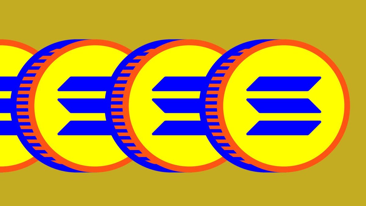 An image of three coins with the Solana logo on them.