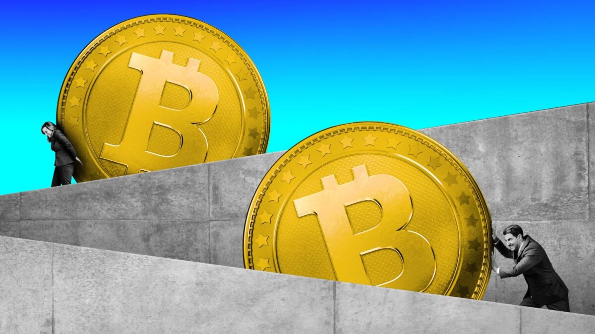 Two people pushing up the two coins with the Bitcoin logo.