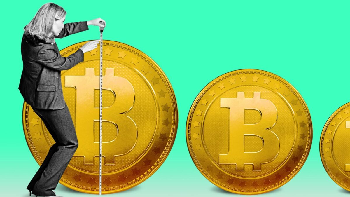 woman measuring coins with bitcoin logo with measuring tape