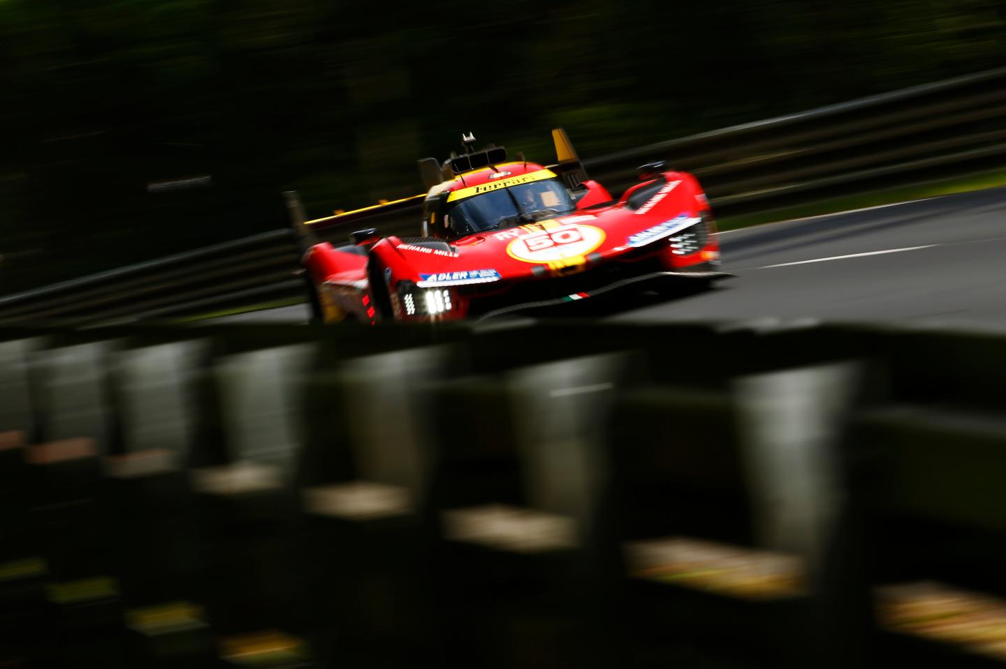 A Ferrari race car on a racetrack