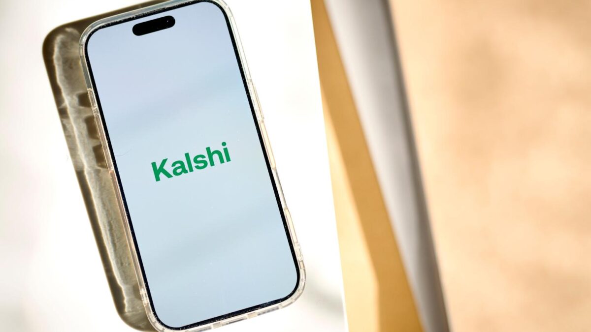 A phone screen showing the Kalshi logo