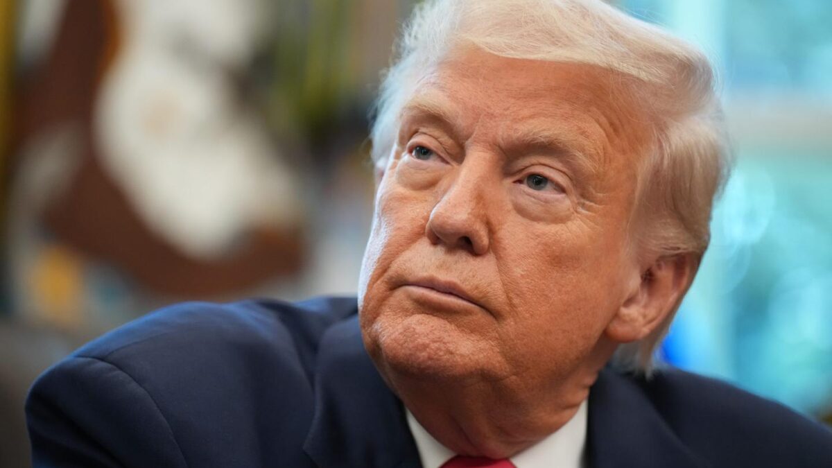 A photo of Donald Trump looking off image in a suit.