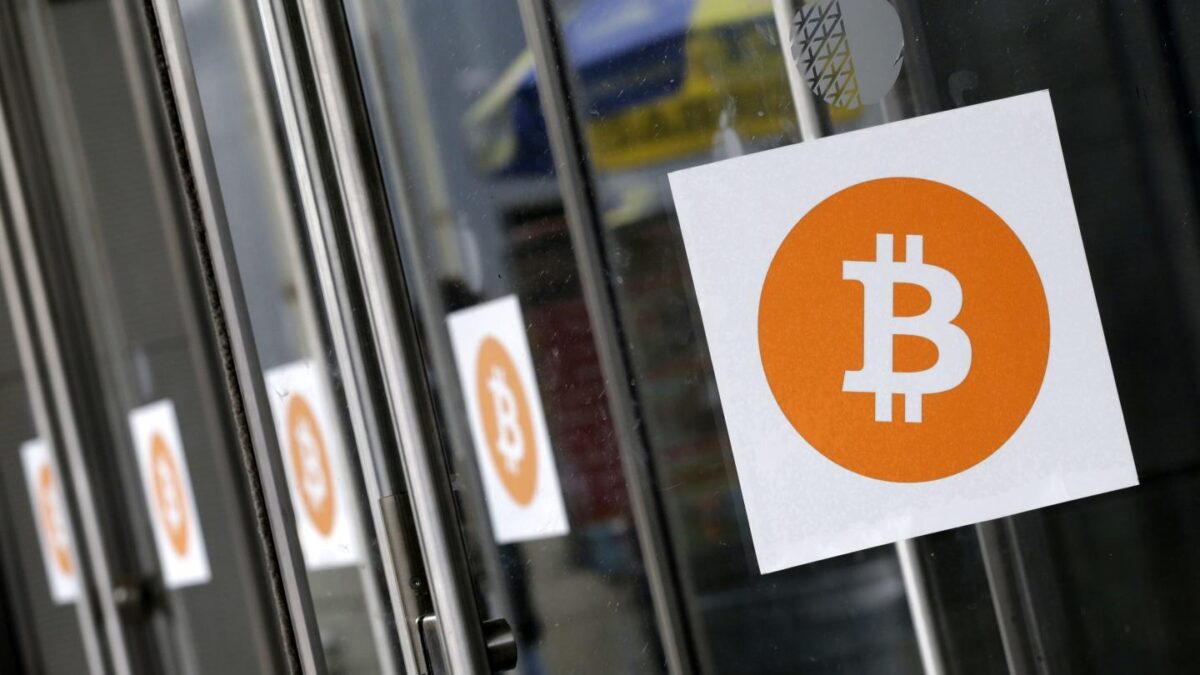 Bitcoin logos are displayed at the Inside Bitcoins conference and trade show on April 7, 2014, in New York.