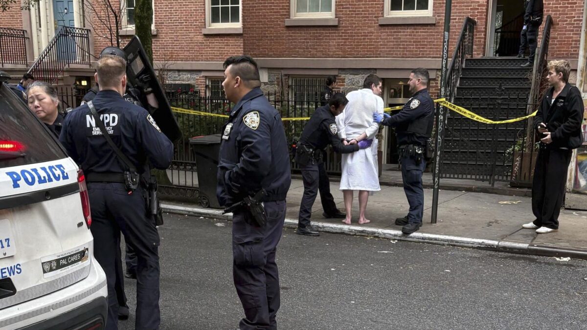New York police officers arrest John Woeltz, on May 23, 2025, in New York, who was charged with kidnapping, assaulting and holding a man against his will for several weeks in an upscale Manhattan townhouse.