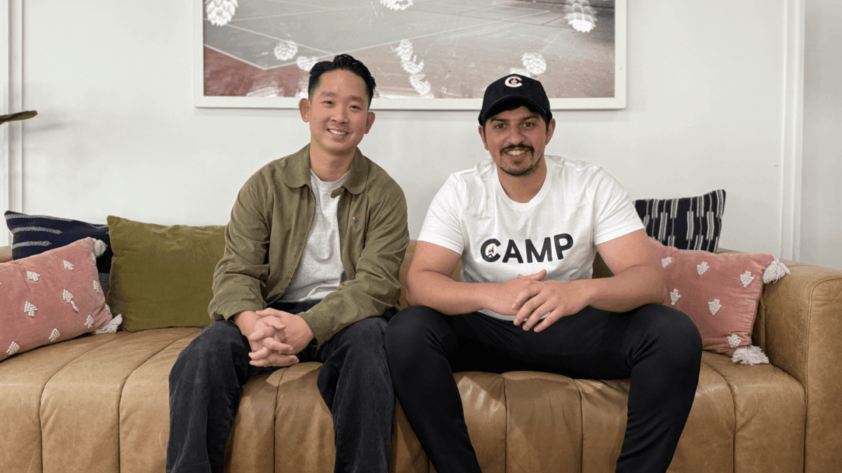 James Chi and Nirav Murthy sit on a couch together.