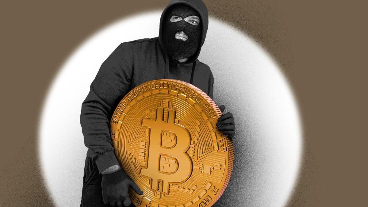 One man, male criminal dressed all in black, carrying stolen Bitcoin