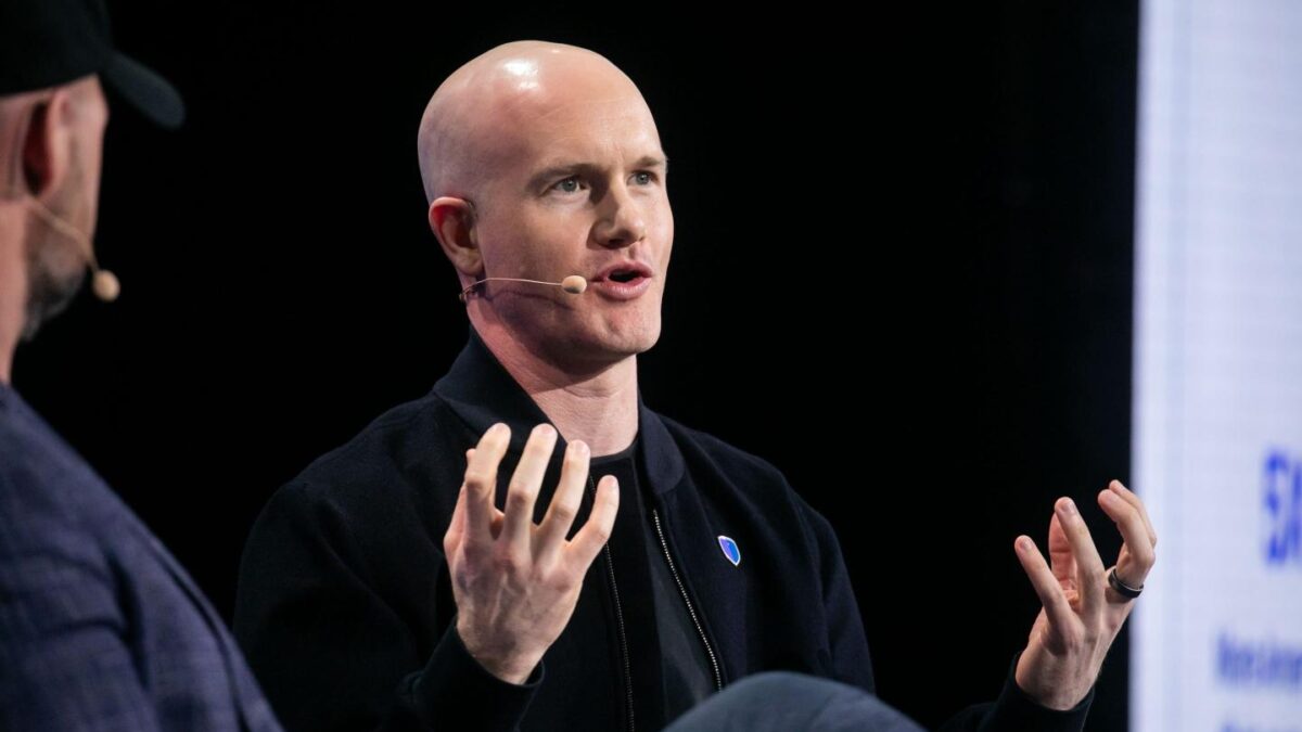 Brian Armstrong speaks at a crypto conference.