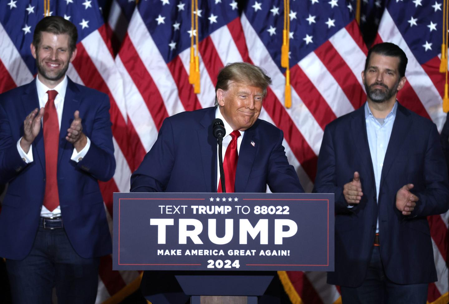 President Donald Trump, flanked by sons Donald Jr., left, and Eric.