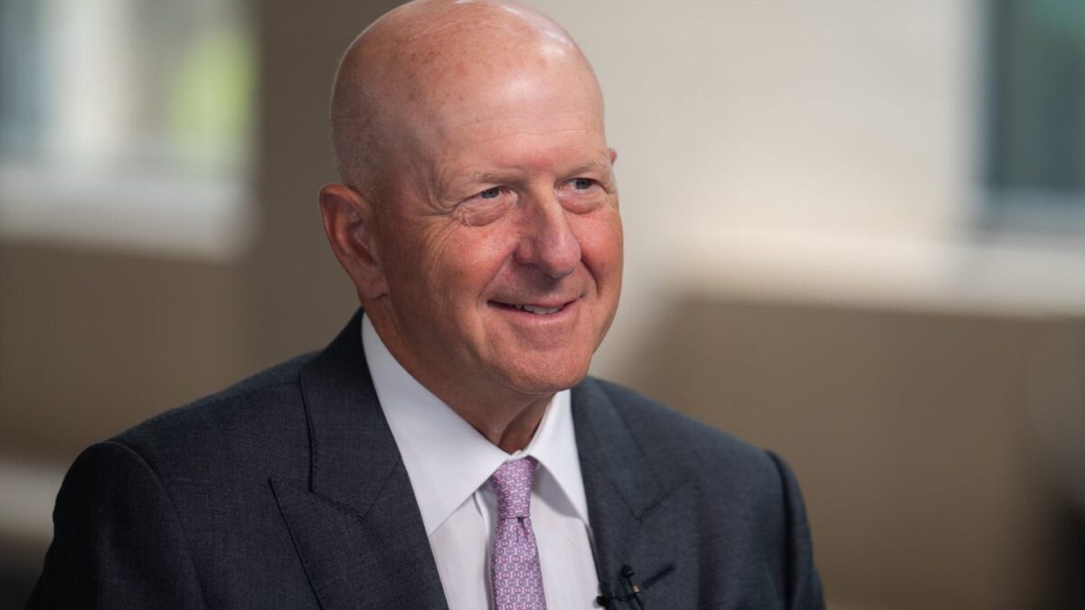 David Solomon smiles at the camera during an interview.