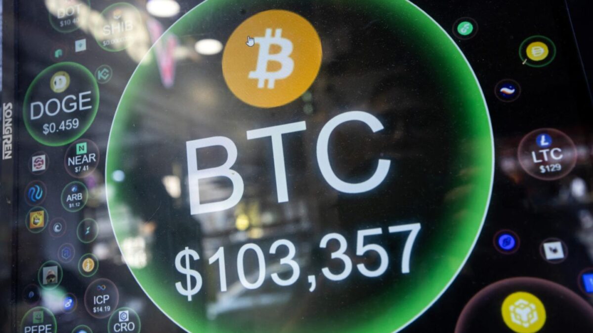 The price of Bitcoin is displayed on a screen at a cryptocurrency exchange store in Hong Kong, China.