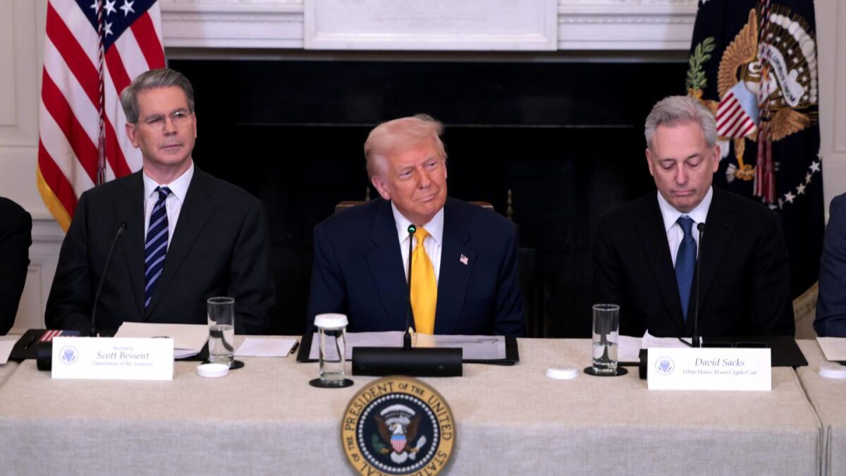 President Donald Trump speaks alongside Treasury Secretary Scott Bessent (left) and White House crypto czar David Sacks at the White House Digital Assets Summit on March 7, 2025.