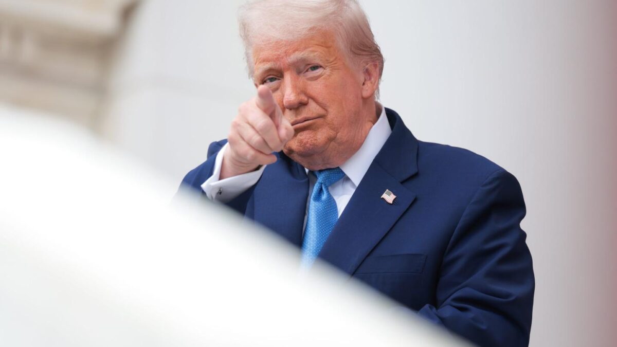 Trump points at the camera.
